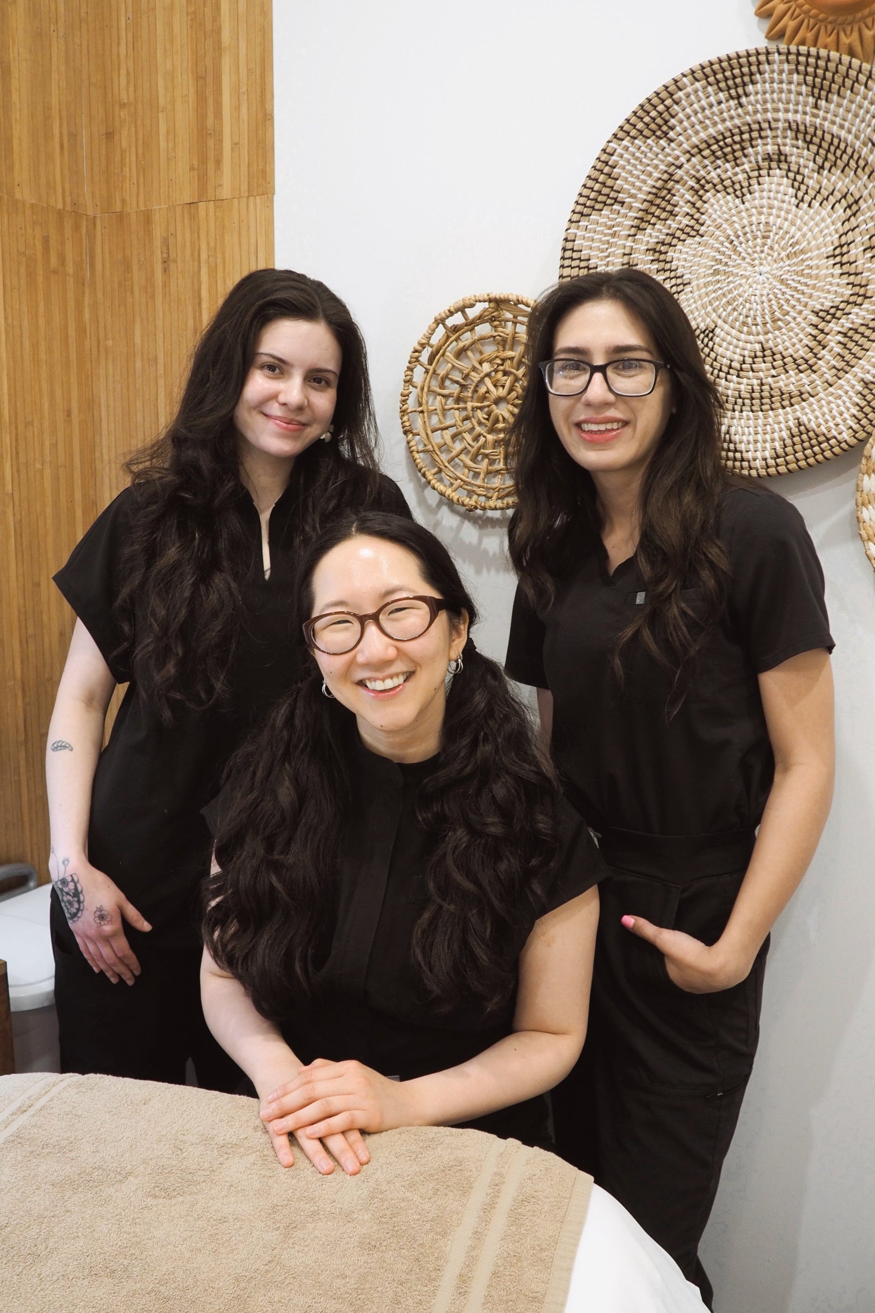 Your favorite Skin Revival specialists together as a team with Esther, The Korean Esthetician and Founder, sitting in between Mica and Raylea