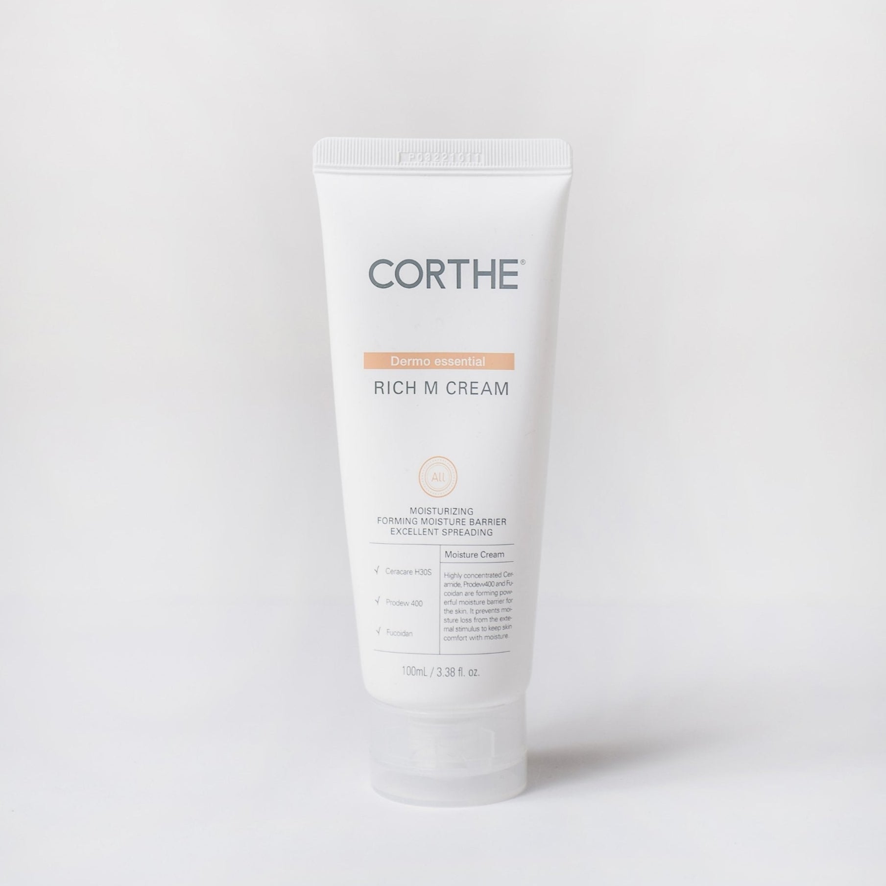 A white tube packaging of CORTHE Rich M Cream with product information and branding on it.